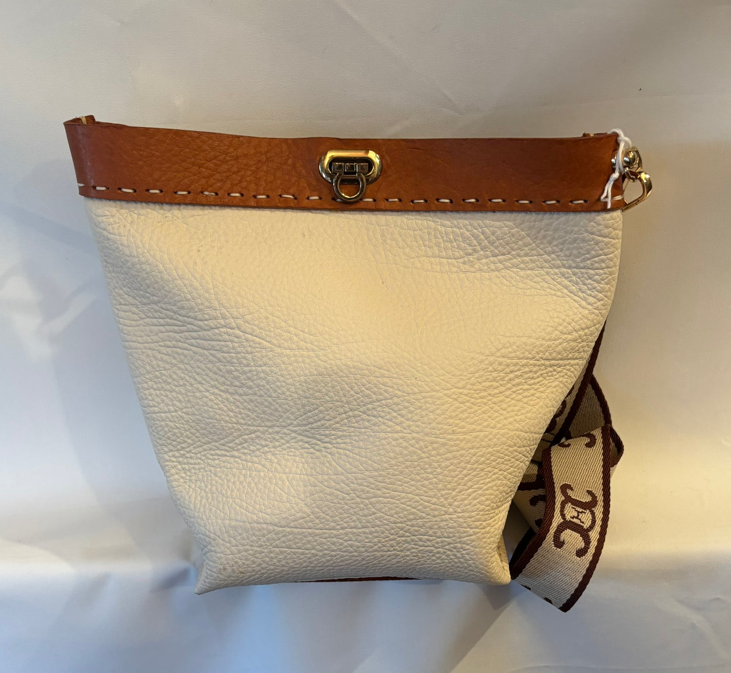 Delightful pebble leather crossbody bag with distressed leather accents