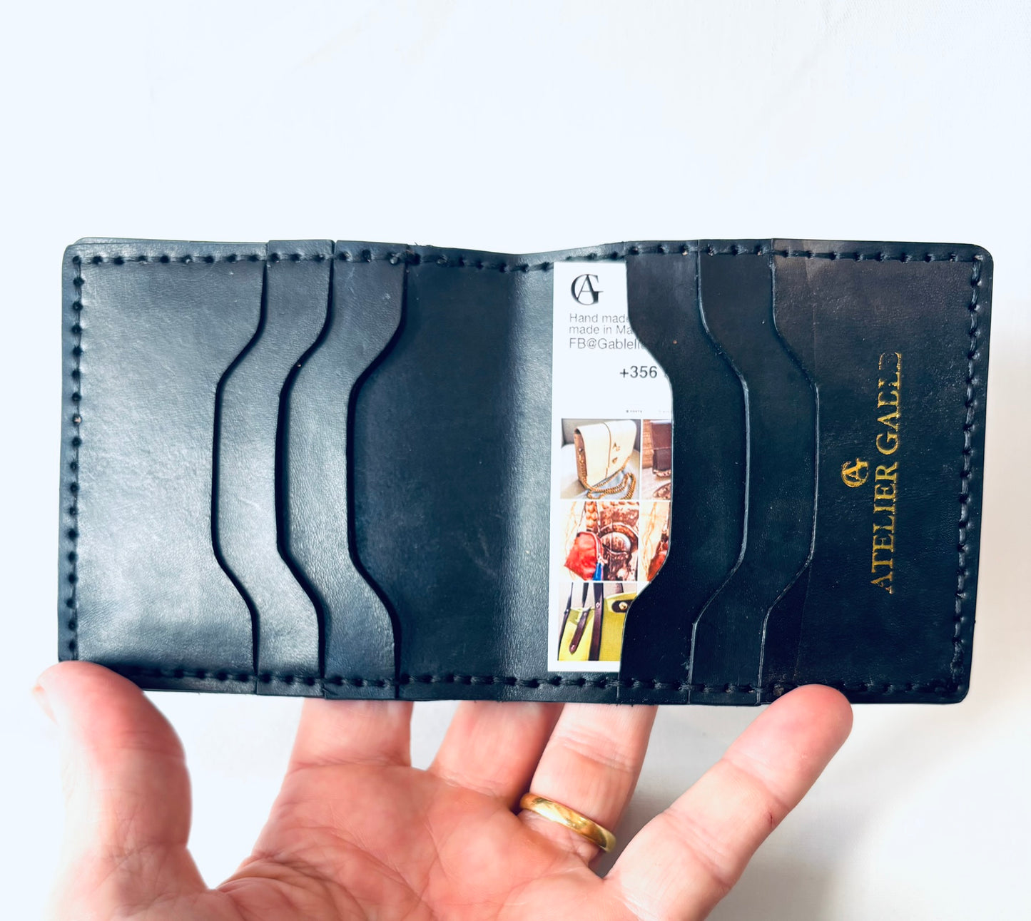 Black embossed wallet with note section