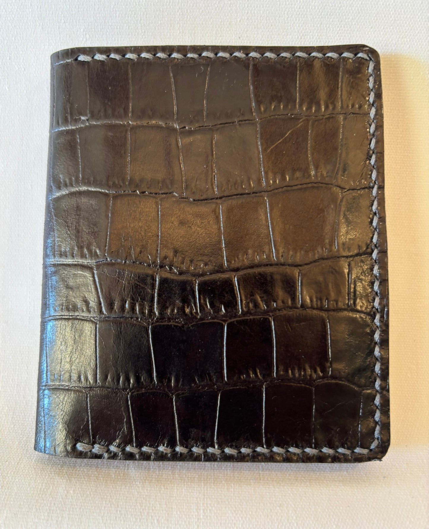 Black embossed micro wallet with stunning pink inner