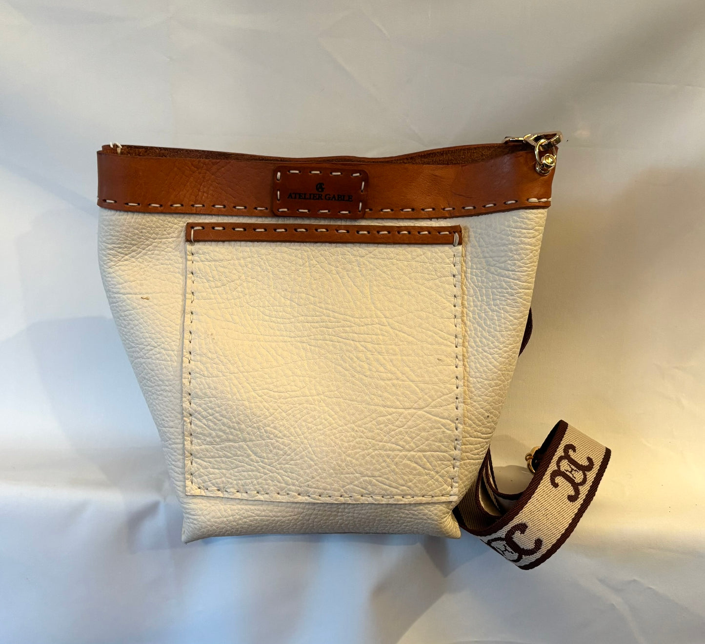 Delightful pebble leather crossbody bag with distressed leather accents
