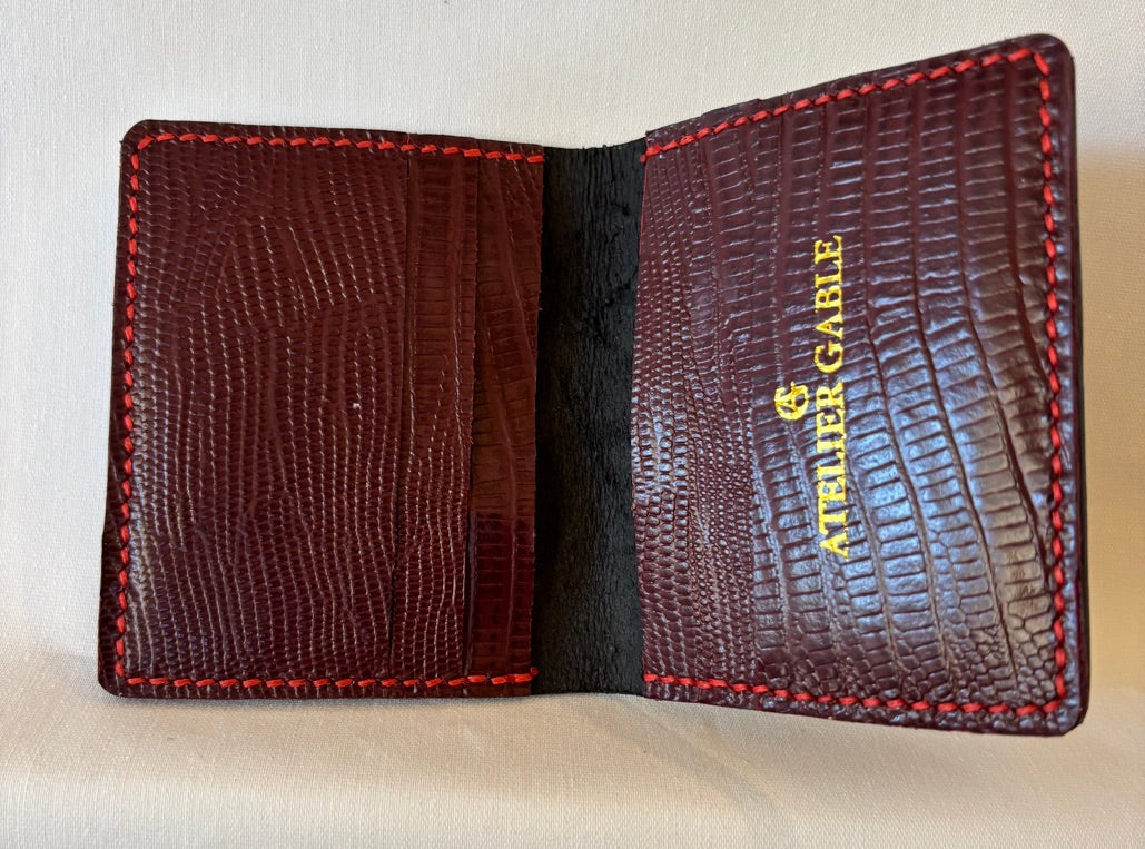 Black saffiano micro card wallet with burgundy reptile embossed inner