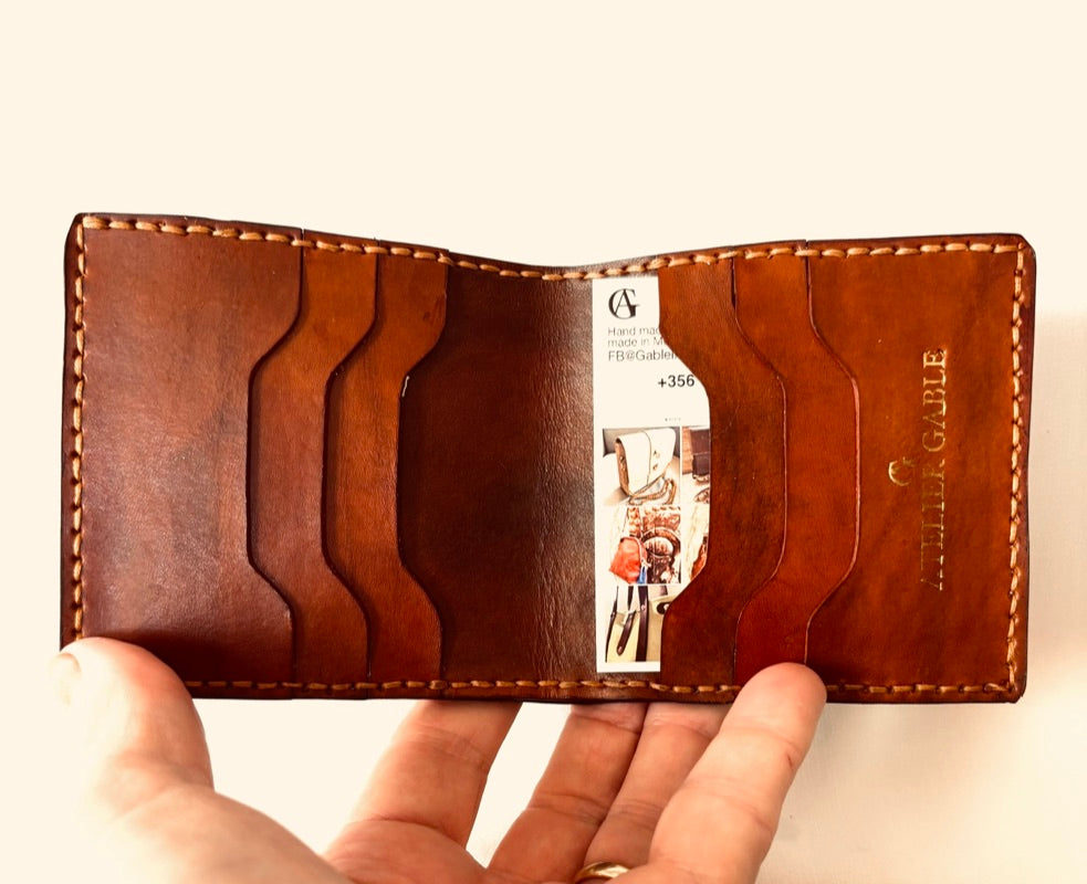 mid brown embossed wallet with note section